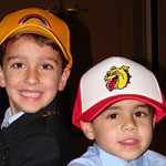 two boys wearing patch hats