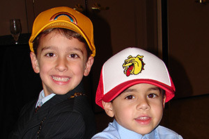 two boys wearing patch hats
