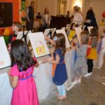Display of paint and canvases for juice box and paint party for kids