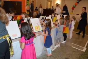 Display of paint and canvases for juice box and paint party for kids