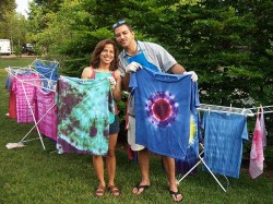 couple showing off their Tie-Dye tees