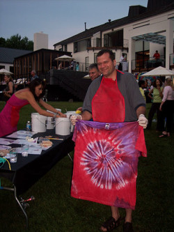 Man showing off his tie-dye tee