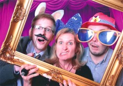 party guests posing for green screen photo