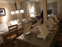paint night set-up with blank canvases