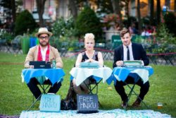 three haiku writers working on their typewriters creating poems for party guests